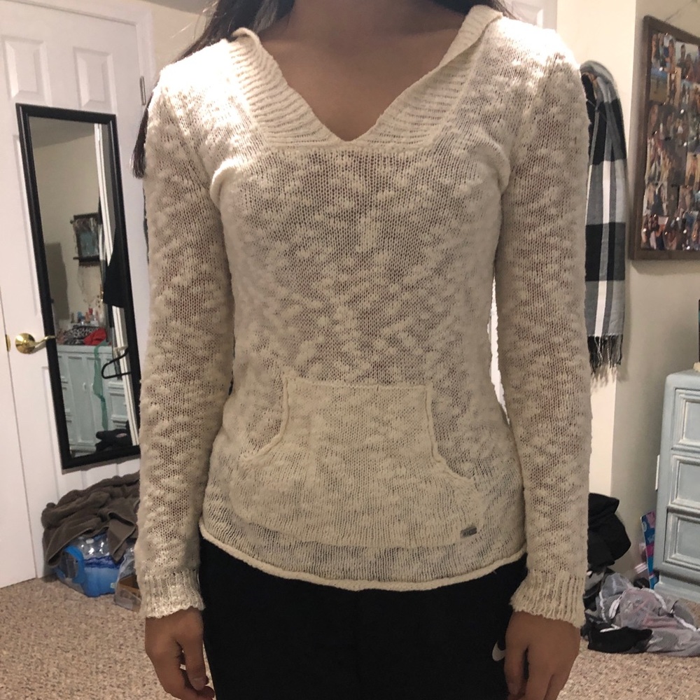 A cream sweater